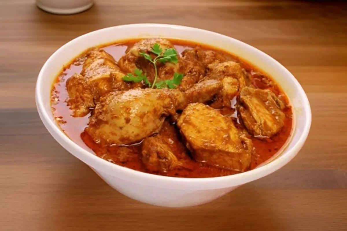 A bowl of light Indian chicken curry