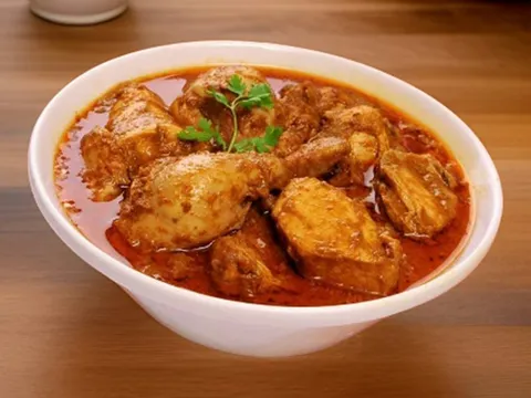A bowl of light Indian chicken curry