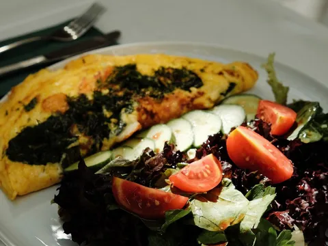 An Indian masala omelette with onion and tomato