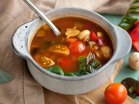 A bowl of clear mixed vegetable soup