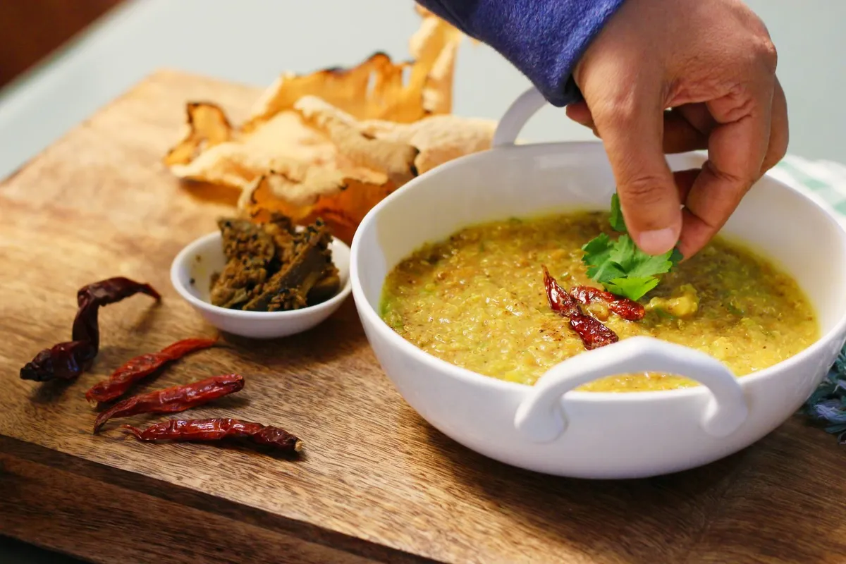 A bowl of moong dal khichdi with vegetables