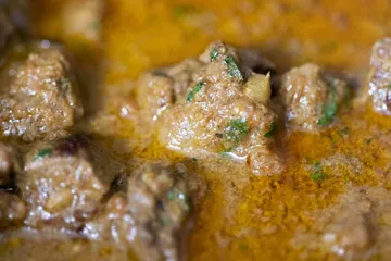 A bowl of soya chunk curry in a spiced gravy